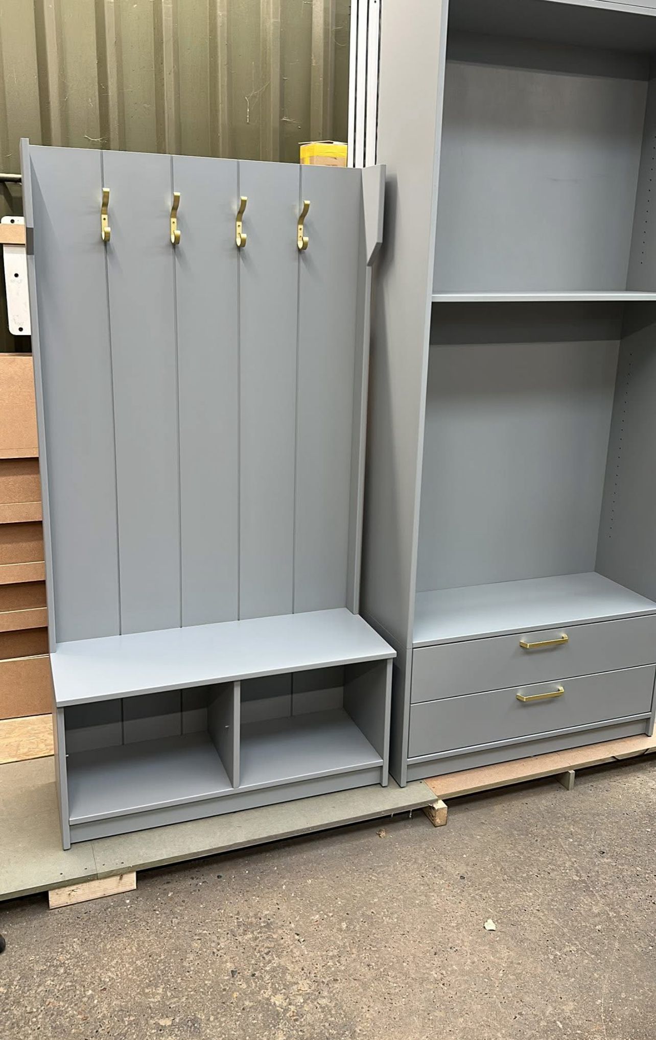 Custom gray built-in storage with elegant brass hardware accents